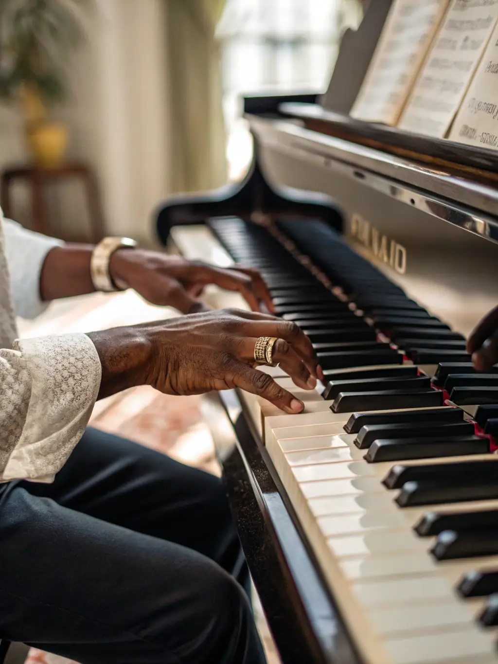 A detailed shot of an organist's hands skillfully playing the keys of a historic organ during a workshop session.